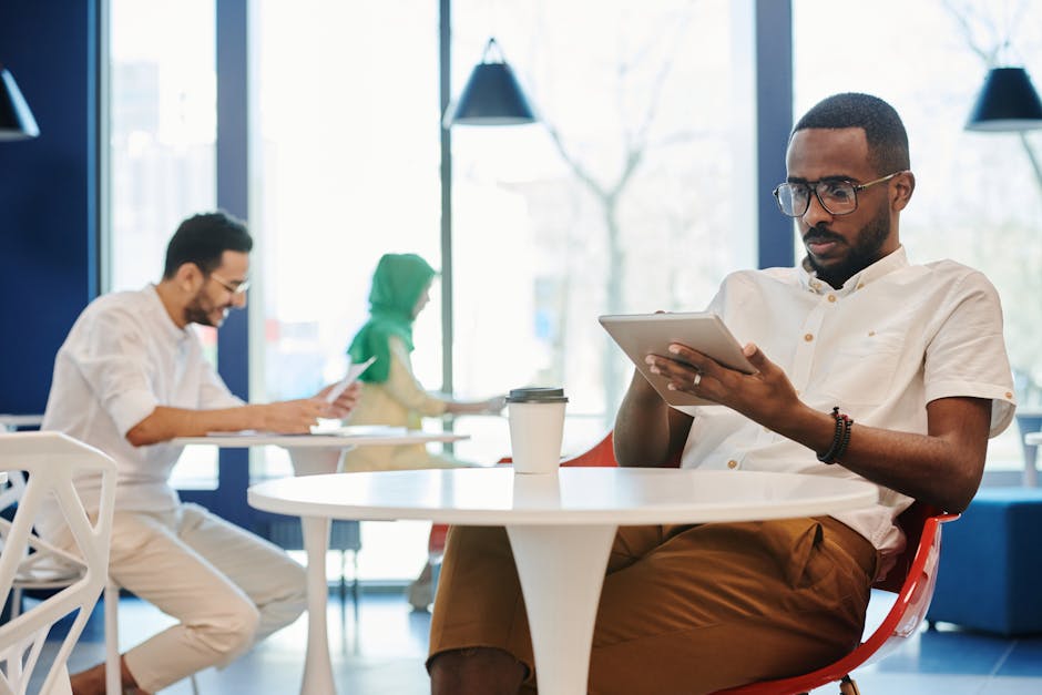 A community manager in a coworking space introducing two members to each other during an everyday connection moment