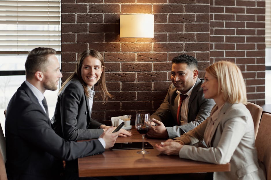 Three professionals in a close small-group conversation, the follow-up that well-chosen matchmaking software makes possible