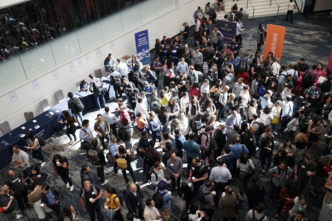 Huge conference crowd whose behaviour becomes the event sponsor data that drives renewals