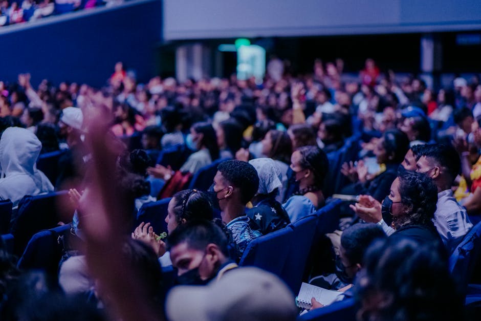 Huge conference crowd mid session giving the raw signal used to measure event networking success