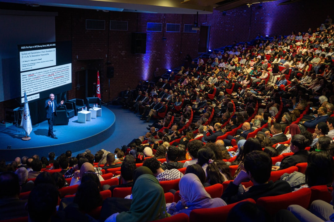 Full auditorium of attendees whose pre event networking starts before the opening keynote