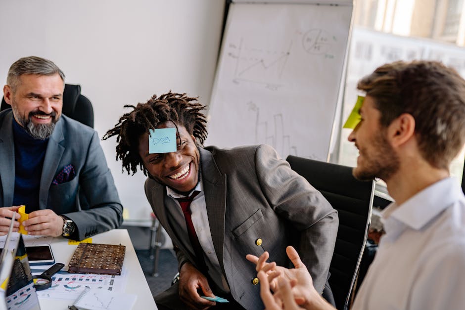 Small group of early-career professionals in a structured icebreaker activity that softens young professional loneliness